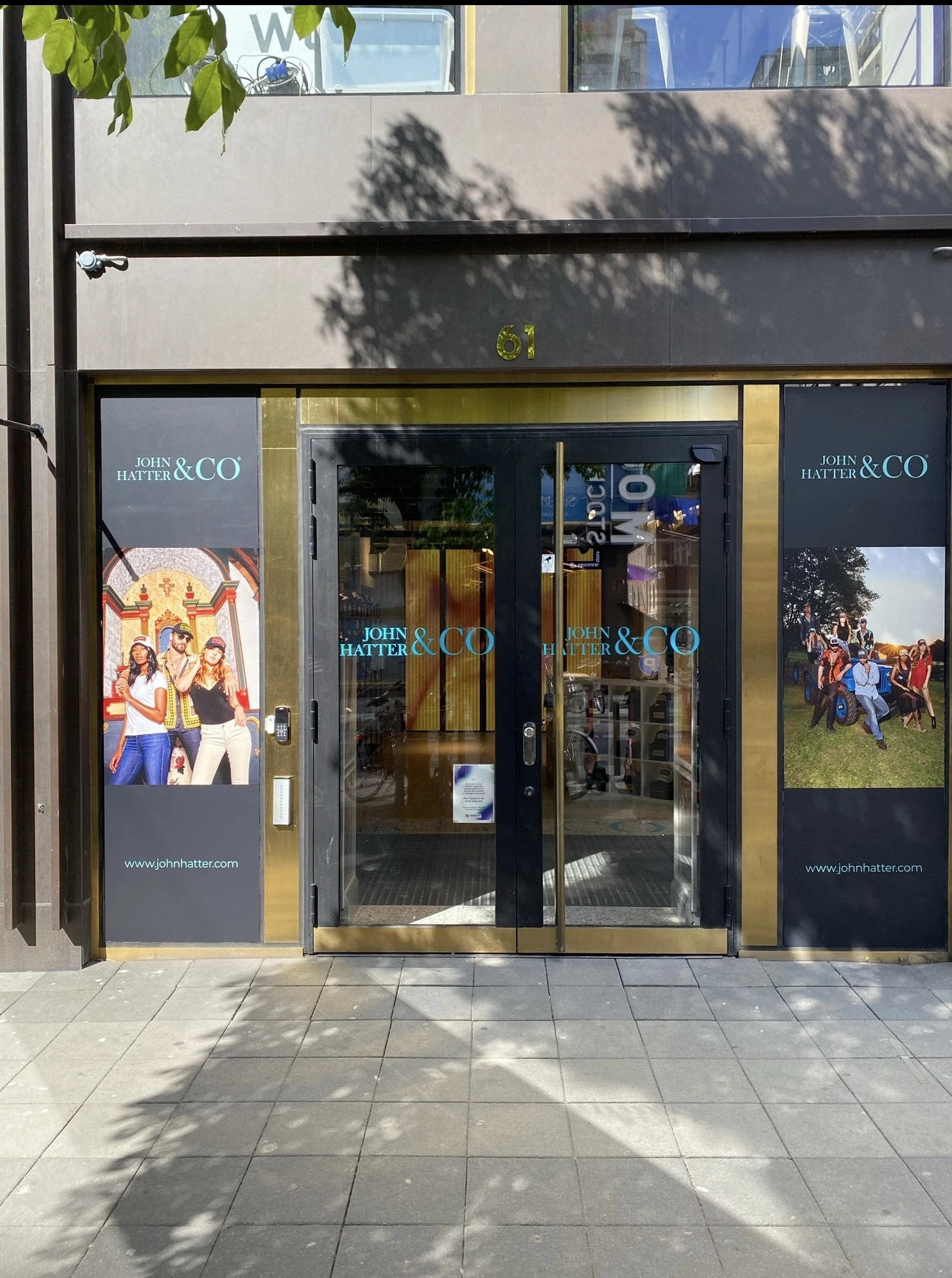 John Hatter and Co store entrance with branded windows and campaign photography